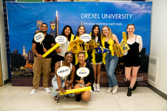 A group of eight Drexel Dornsife students pose at the year-end celebration